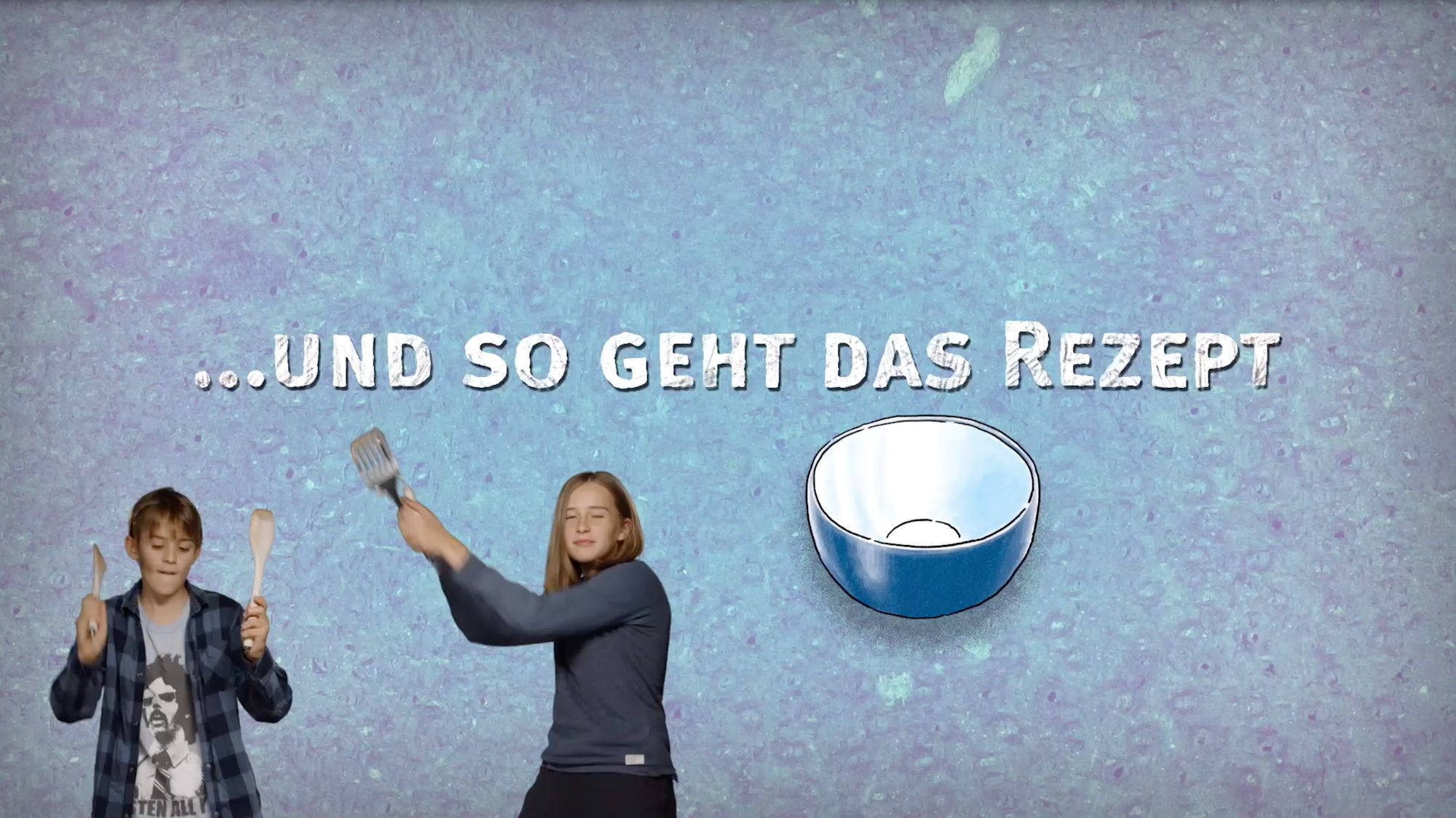Zwischentitel „...und so geht das Rezept“ mit tanzenden Kindern und gezeichneter Schüssel
